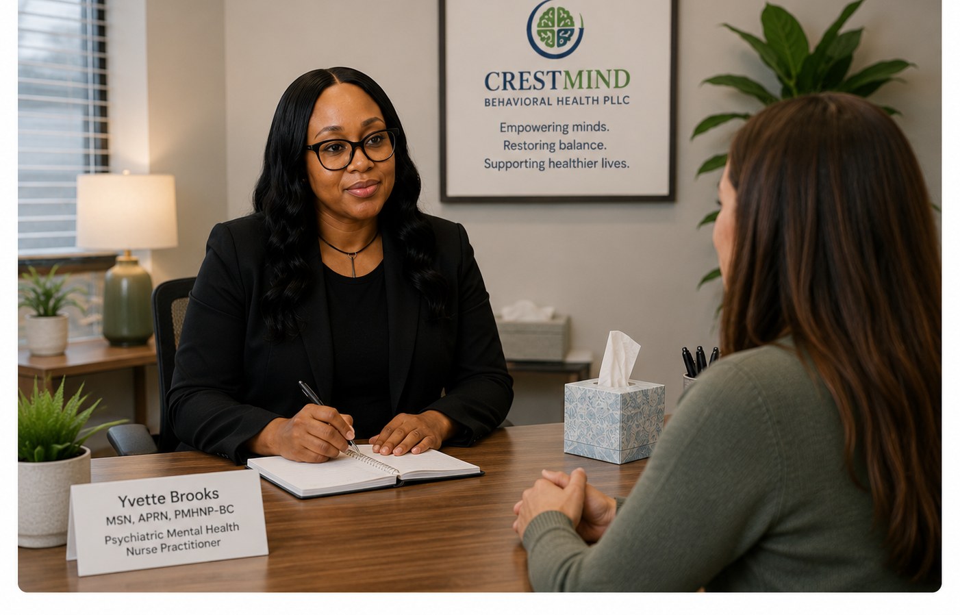 Yvette Brooks meeting with a patient during an in-person consultation